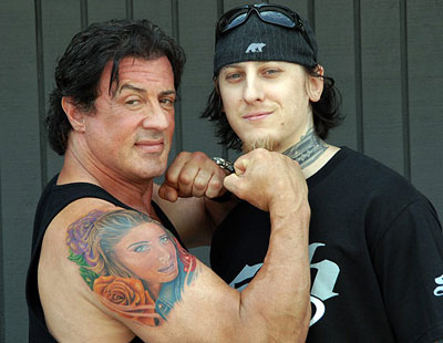 sylvester-stallone-wife-tattoo-pose